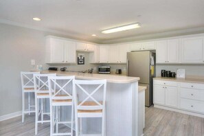 Fridge, microwave, oven, stovetop - Explore Oak Island from OW 6204-Anchors Away, a 3BR oceanview condo for 8. (Oak Island)