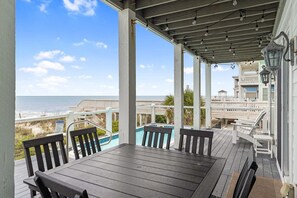 Outdoor dining - Experience luxury at Shangri-La, an oceanfront 10-bedroom retreat in Oak Island. (Oak Island)