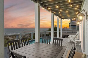 Outdoor dining - Experience luxury at Shangri-La, an oceanfront 10-bedroom retreat in Oak Island. (Oak Island)