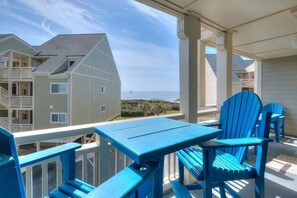 Outdoor dining - Oceanview escape in Oak Island. OIBV 805 features 2 bedrooms, pool, and beach access. (Oak Island)