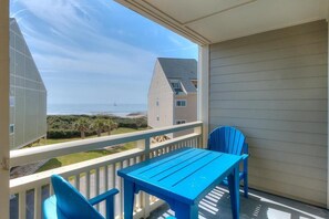 Outdoor dining - Oceanview escape in Oak Island. OIBV 805 features 2 bedrooms, pool, and beach access. (Oak Island)