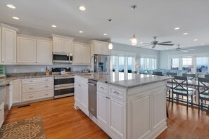 Fridge, microwave, oven, stovetop - Orange Sunset: Spacious 7-bedroom oceanfront gem in Oak Island, perfect for large groups. (Oak Island)