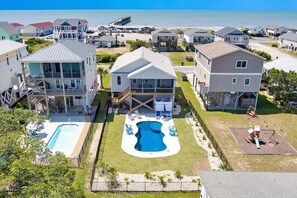 Exterior - Experience ocean views at "Footprints in the Sand," a cozy 3BR retreat in Oak Island. (Oak Island)