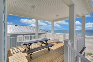 Outdoor dining - Oceanfront retreat in Oak Island with 7 bedrooms and pool for 20 guests. (Oak Island)