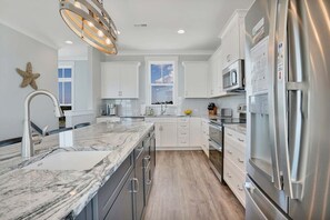 Fridge, microwave, oven, stovetop - Oceanfront retreat in Oak Island with 7 bedrooms and pool for 20 guests. (Oak Island)