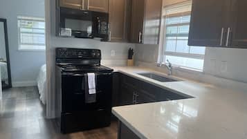 Microwave, coffee/tea maker, cookware/dishes/utensils