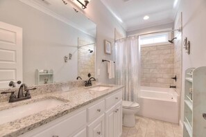 Bathtub, towels - Captain Morgans Cove: Spacious 3BR retreat in OKI with modern amenities and nearby beach access. (Oak Island)
