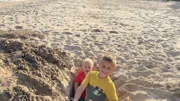 Guests can enjoy a day of beach activities, including digging in the sand.