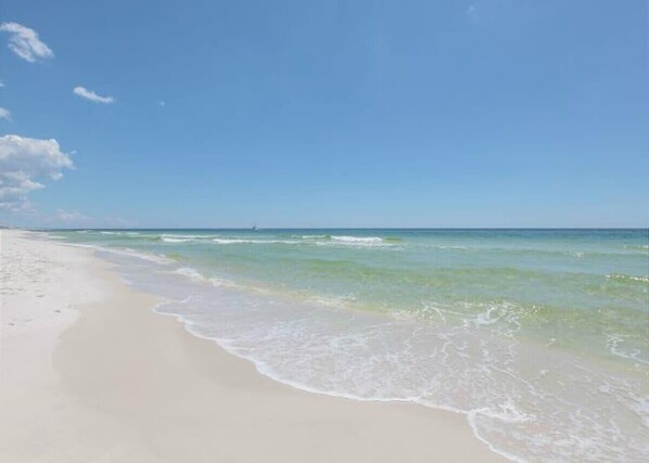 A beach with clear skies and calm waters.