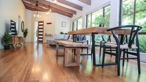 A spacious living area with a wooden dining table, chairs, and a ceiling fan. - Haus on Houghs : Space and style in Bright (Bright)