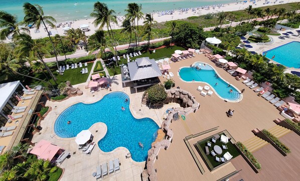 A heated pool, pool umbrellas