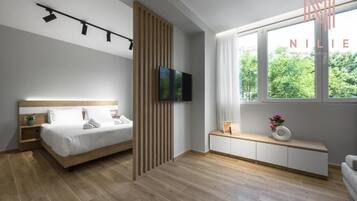 Deluxe Suite, Kitchen | Individually furnished, soundproofing, free WiFi, bed sheets