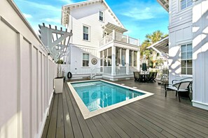 A heated pool, sun loungers