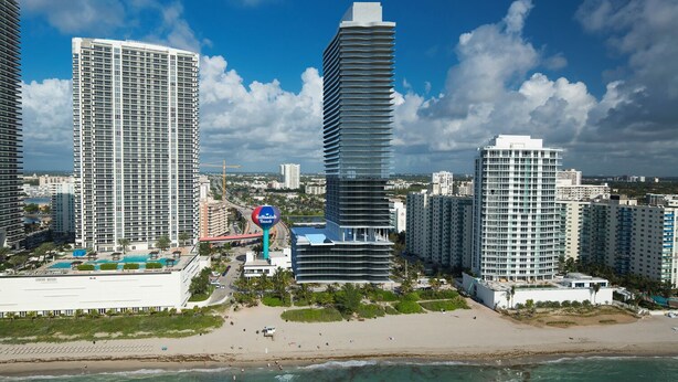 A coastal cityscape with high-rise buildings, a beach, and a clear sky. - Hollywood beach apartment on the beach the biggest in the building all new  (Hollywood)
