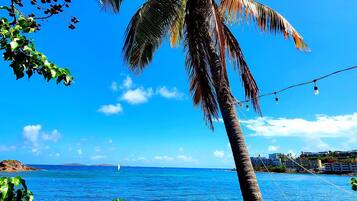 On the beach, sun loungers, beach towels