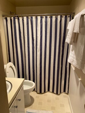Combined shower/bathtub, hair dryer, towels, soap - Harstine Island cabin (Shelton)