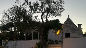 A building with a conical roof and a tree in front. - Romantic Trullo with Pool: Entire Private Property❣️ (Alberobello)