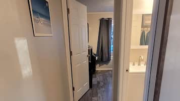 Combined shower/bathtub, hair dryer, towels, soap