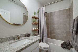 Combined shower/tub, hair dryer, towels, soap