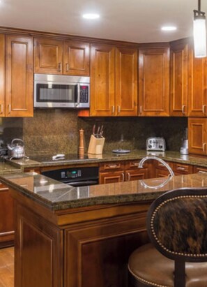 Enjoy cooking in this well-equipped kitchen with a dishwasher, microwave, and sink.