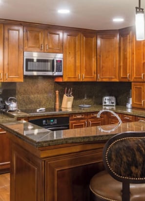 Enjoy cooking in this well-equipped kitchen with a dishwasher, microwave, and sink.