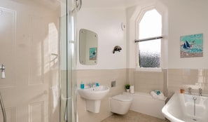A bathroom with a glass shower enclosure, a sink, a toilet, and a bathtub. - Seascape - 3 Bedrooms (North Berwick)