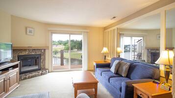 Room, 1 King Bed with Sofa bed, Pool Access | Living room | TV, fireplace