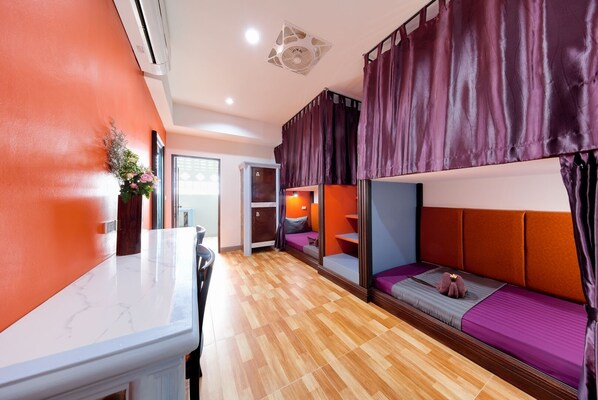 A room with bunk beds, a desk, and a chair. - Kerton Hostel (Koh Samui)