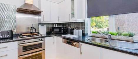 Apartment | Private kitchen | Fridge, microwave, oven, stovetop