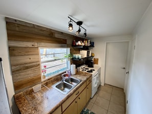Microwave, coffee/tea maker, cookware/dishes/utensils