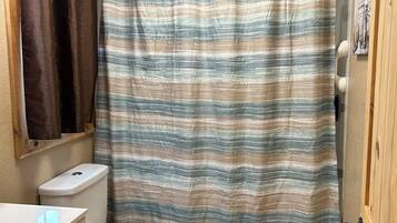 Combined shower/tub, hair dryer, towels, soap