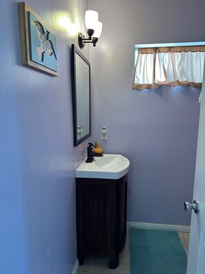 Bathtub, towels, soap, toilet paper