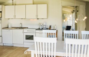 Fridge, stovetop, dishwasher, coffee/tea maker