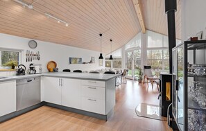 Fridge, stovetop, dishwasher, coffee/tea maker