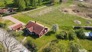A rural property with a large house, a pond, and a fenced area. - Amazing home in Rockneby with sauna (Rockneby)