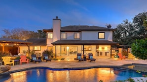 A two-story house with a swimming pool, outdoor seating, and a covered patio area. - North Austin Oasis near Domain  20 min to Downtown (Austin)