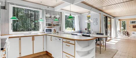 Fridge, stovetop, dishwasher, coffee/tea maker