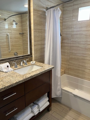 Combined shower/tub, hair dryer, towels, soap