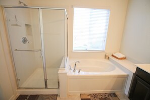 Combined shower/tub, hair dryer, towels, soap