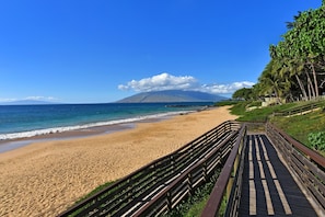 Walk along the beach to the sound of gentle waves.