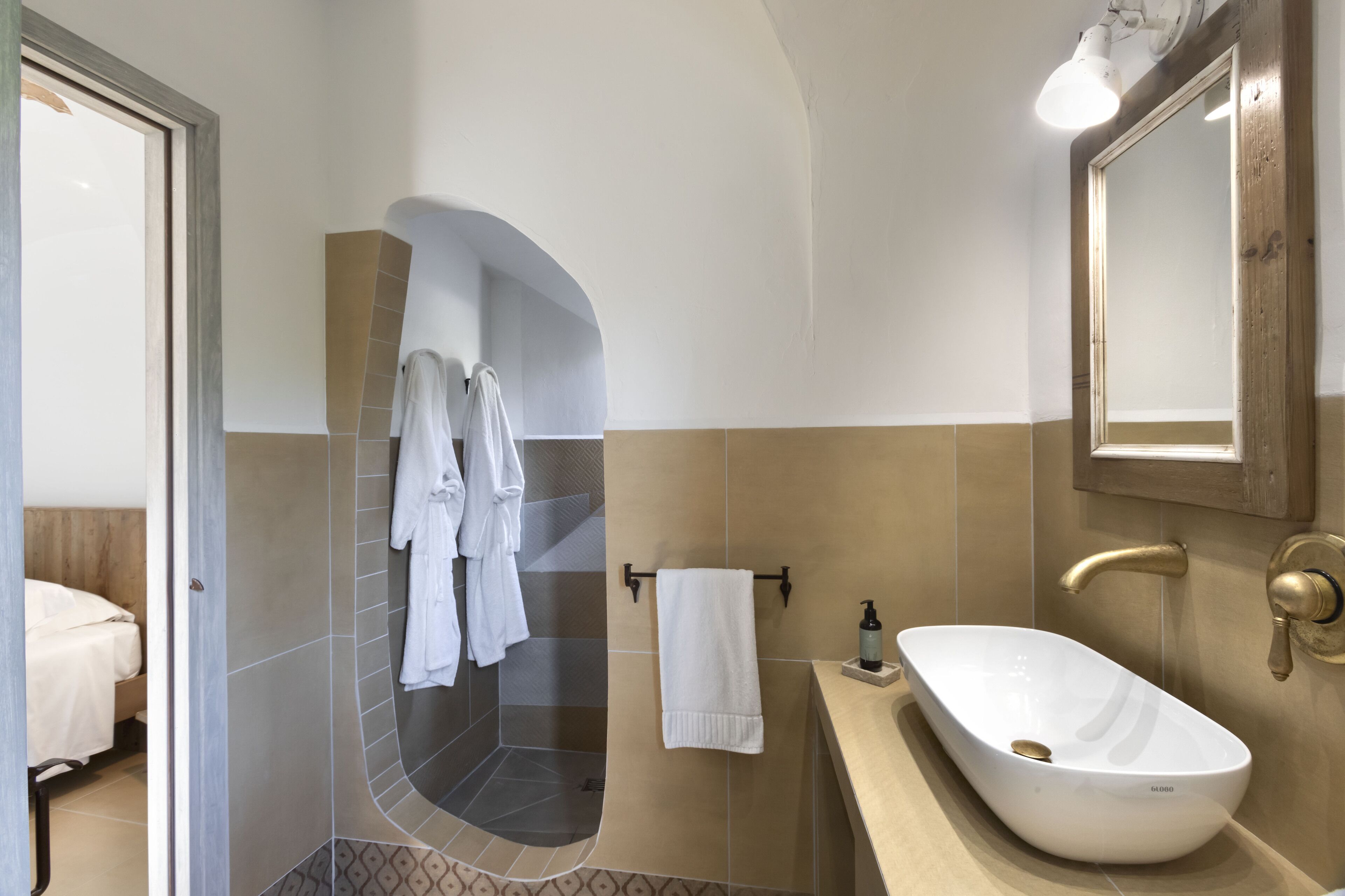 A bathroom with a bathtub, a sink, and a shower.