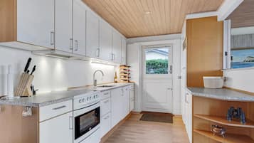 Fridge, stovetop, dishwasher, coffee/tea maker