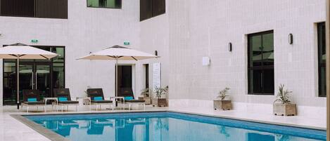 Outdoor pool, open 8:00 AM to 9:30 PM, pool umbrellas