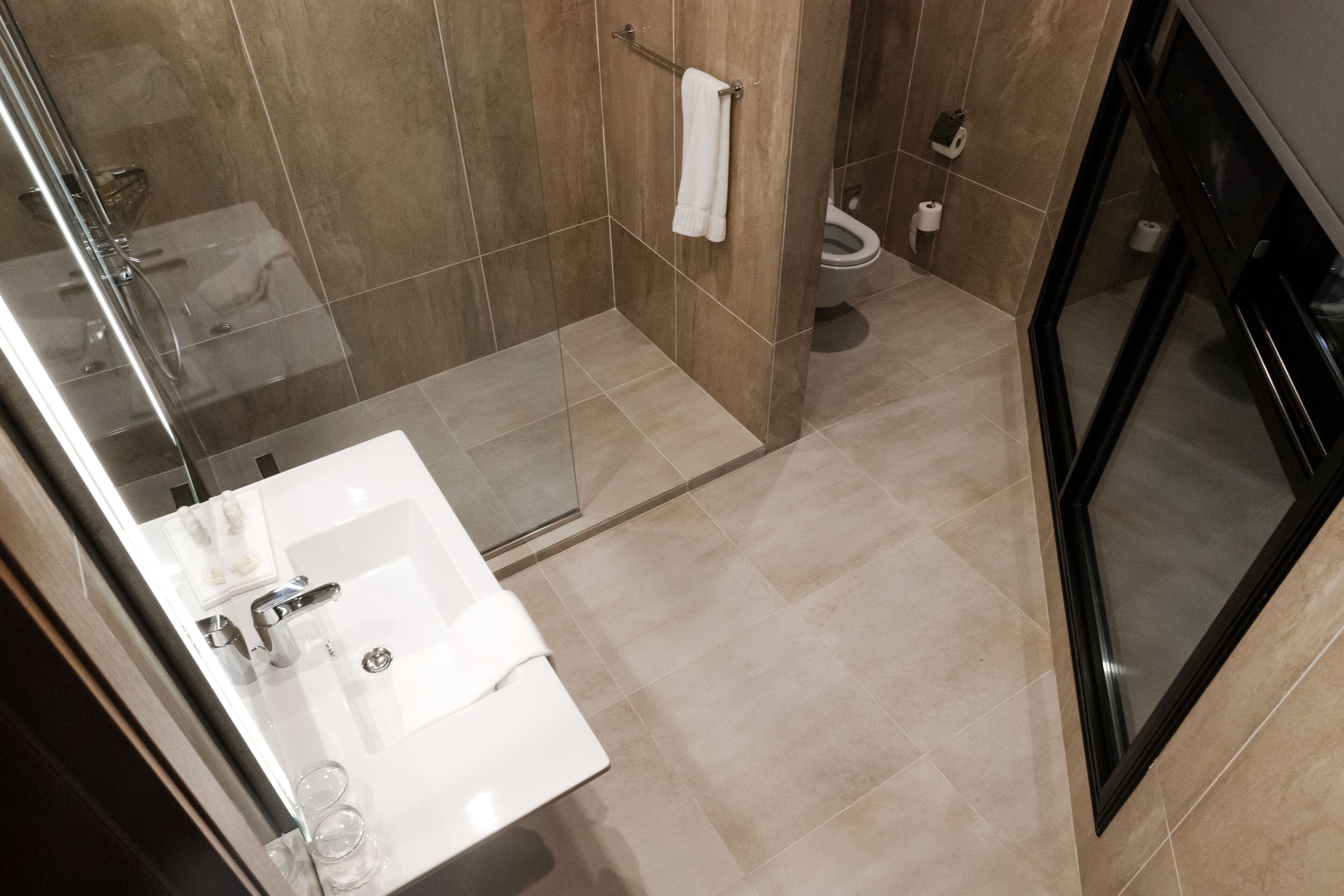 premium suite | bathroom | free toiletries, hair dryer, bathrobes, slippers