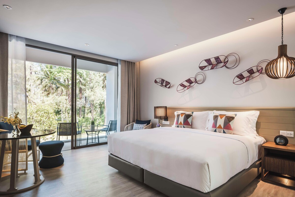 Habitación Deluxe | Ropa de cama de alta calidad y artículos del minibar gratis