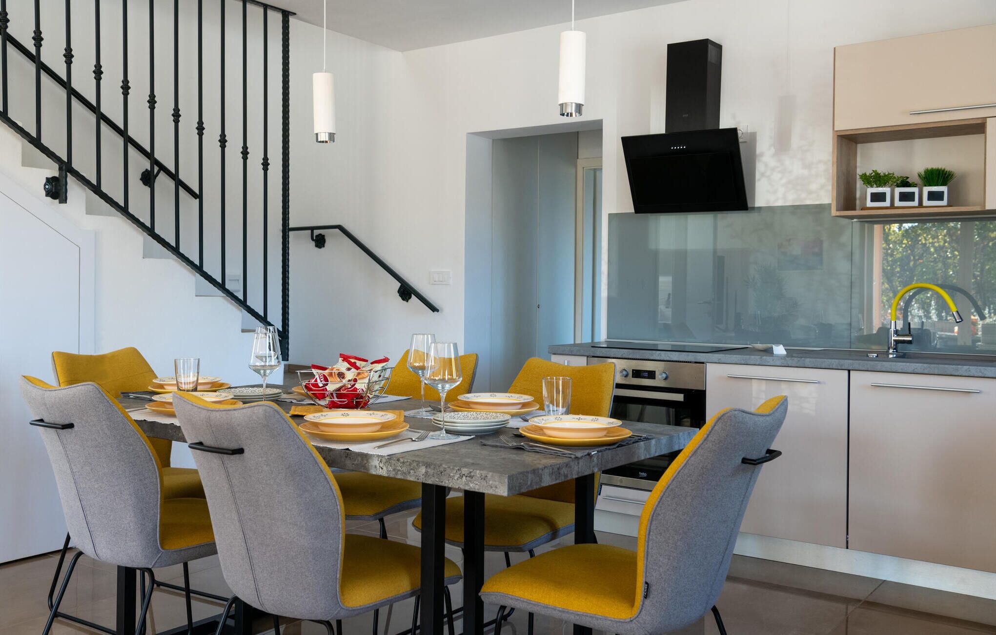 A modern kitchen with a dining area.
