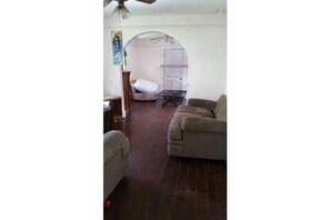 Relax in this serene space with a comfortable sofa and chair.