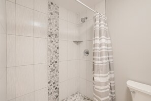 Bathtub, hair dryer, towels, soap