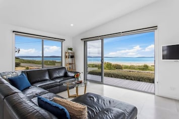 Bask in the breathtaking panoramic ocean views from this spacious living area, designed to make the most of the coastal setting.