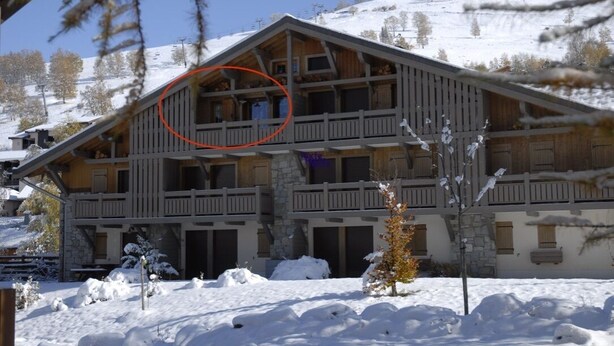 A chalet-style building with a wooden facade, multiple balconies, and a snow-covered landscape. - Le Jardin Alpin: Cozy apartment in a luxury residence (Les Deux Alpes)